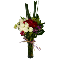 Red and White Roses arrange in a clear Glass Vase